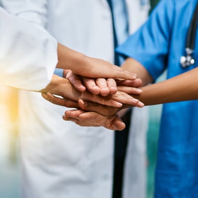 Team of doctors in team huddle