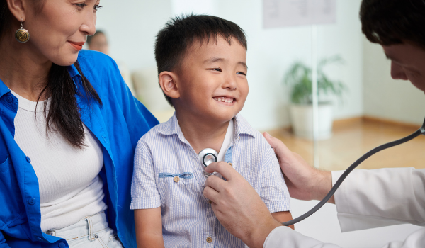 Child being checked by paediatrician