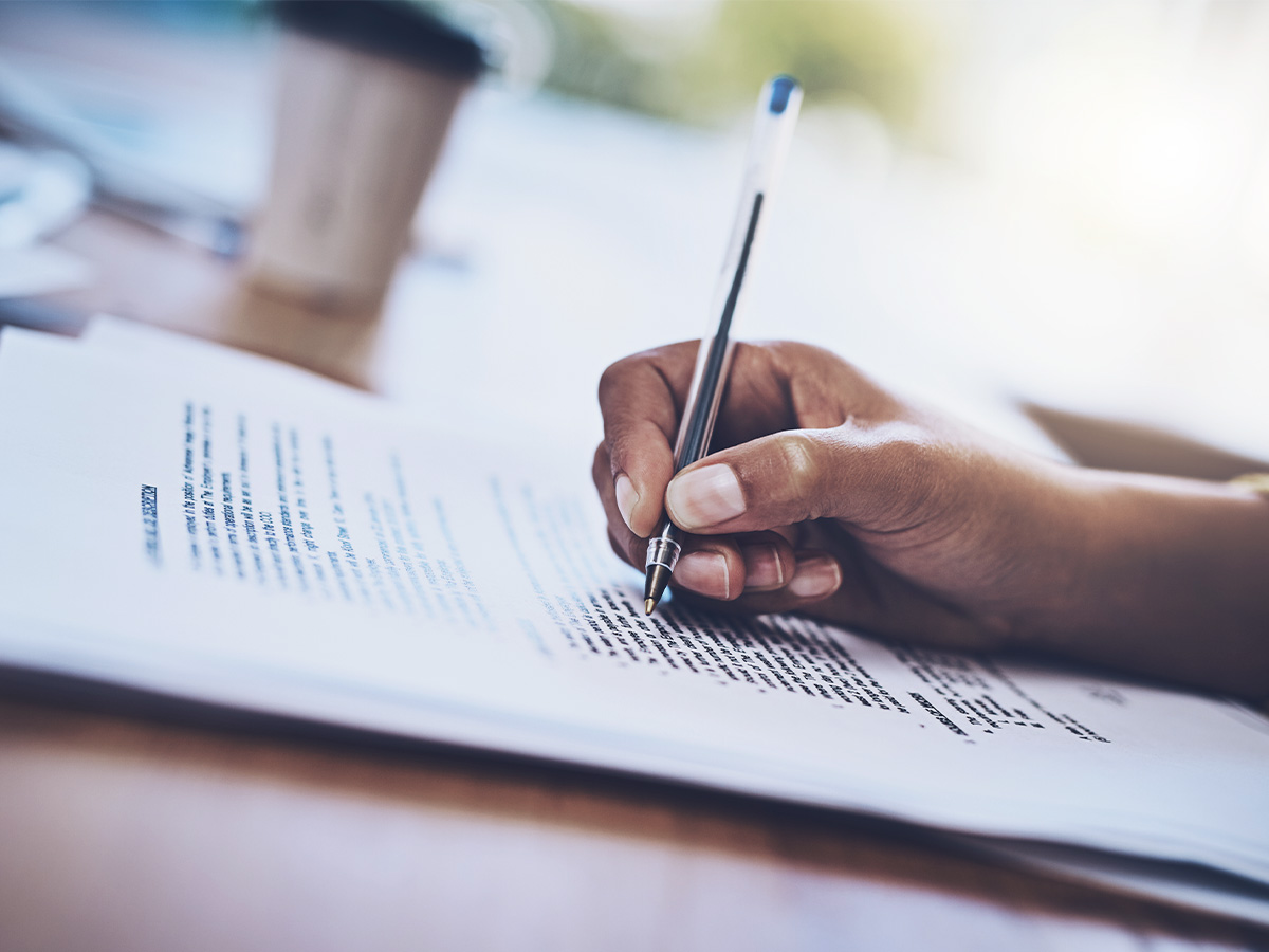 Person making notes on a legal document