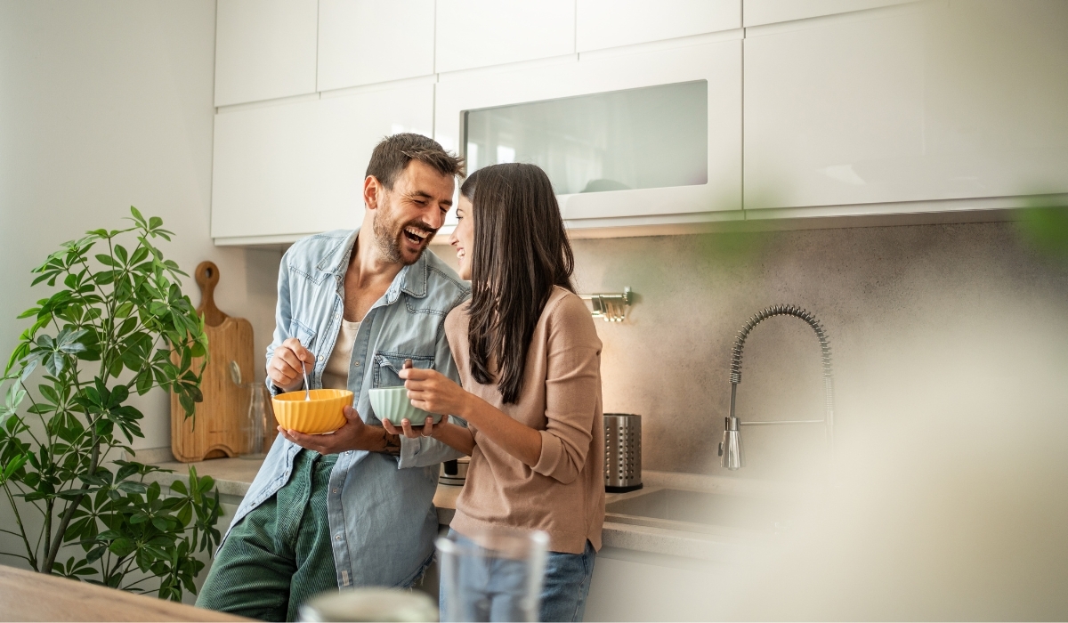Couple laughing in new home