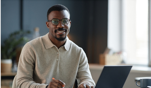 Man on his laptop doing taxes