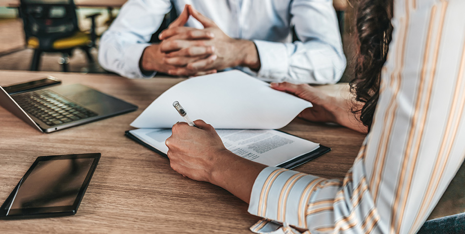 Business workers discussing documents