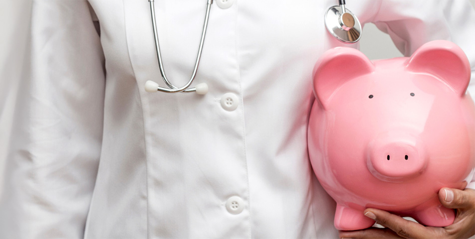 Doctor holding piggy bank