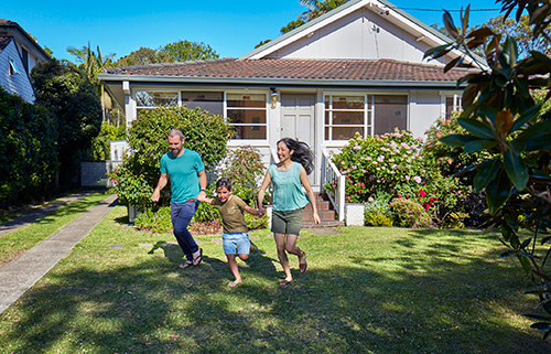 family-playing-in-front-garden-of-australian-house-mobile