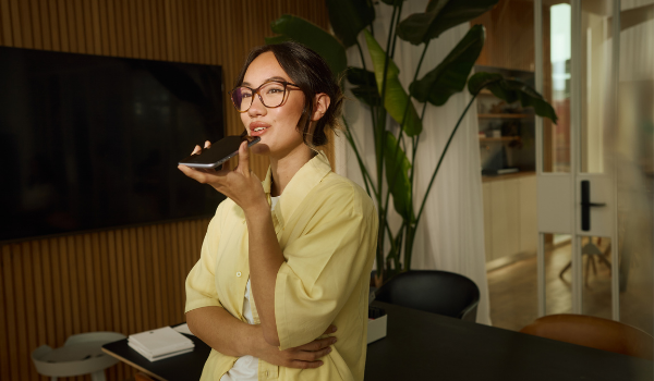 Woman in yellow shirt on the phone