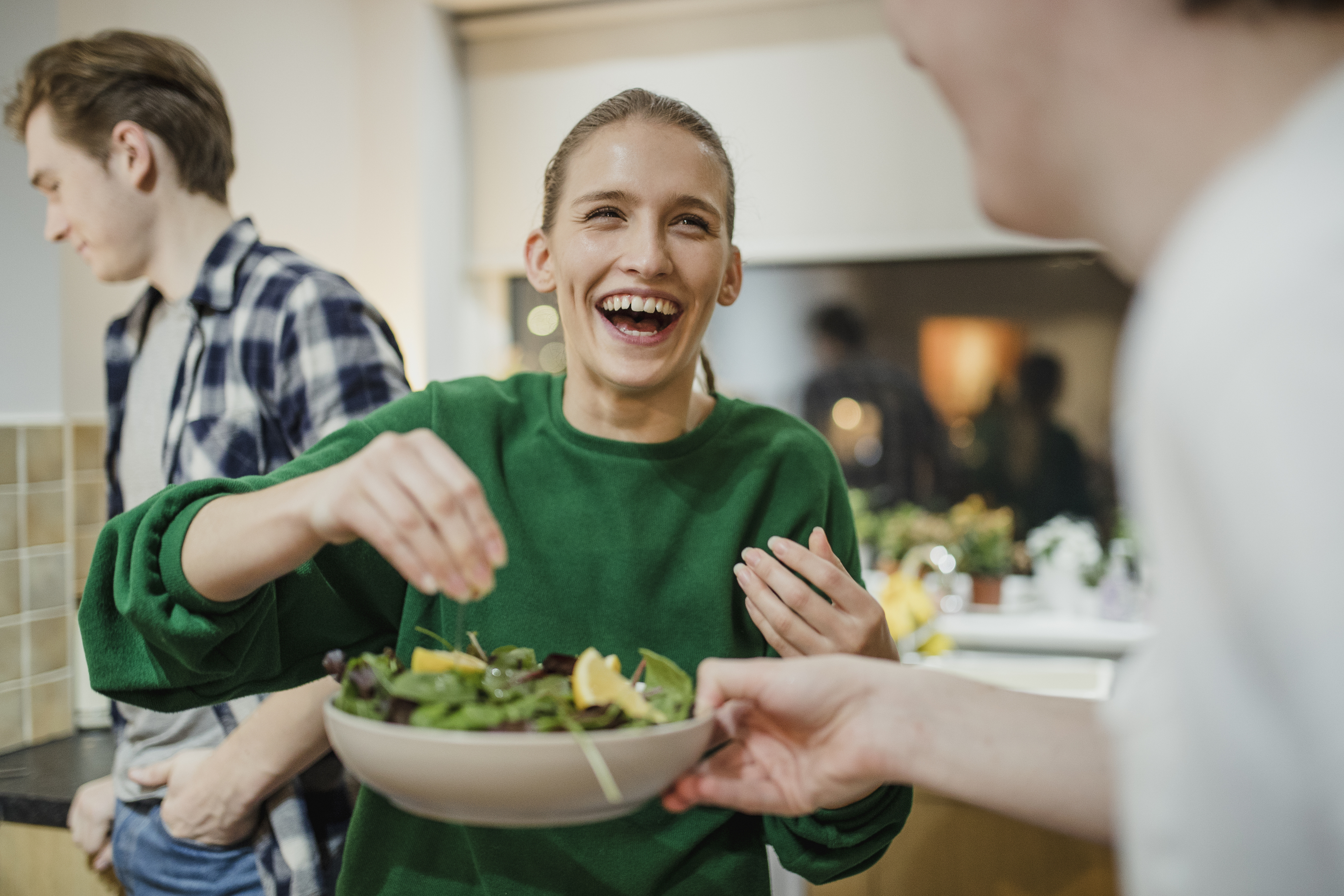 Woman with salad and friends 
